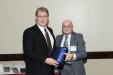 Dr. Nagib Callaos, General Chair, giving Dr. David J. Waters an award "In Appreciation for Delivering s Great Keynote Address at a Plenary Session."